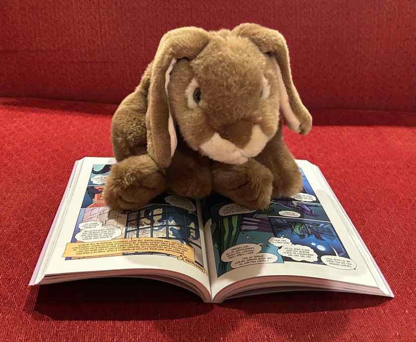 Caramel is reading Darkstalker: The Graphic Novel by Tui T. Sutherland and Jake Parker. 