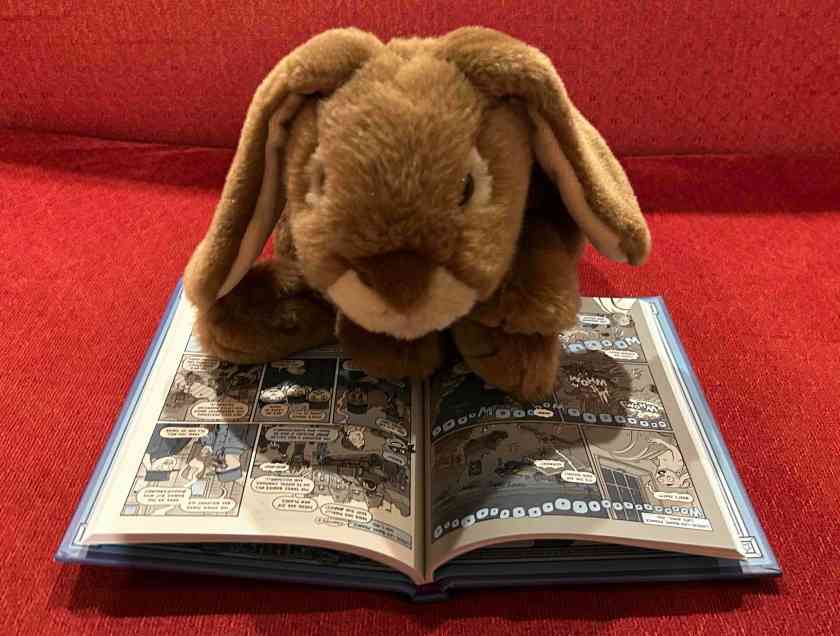 Caramel is reading Nathan Hale’s Hazardous Tales #12: Above the Trenches by Nathan Hale.