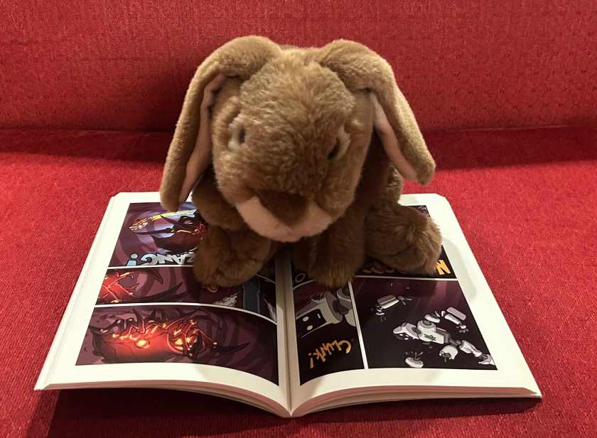 Caramel is reading Missile Mouse: Rescue on Tankium3 by Jake Parker.