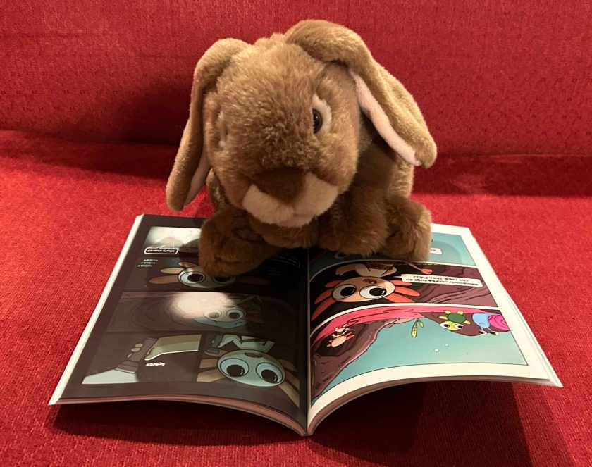 Caramel is reading Max, a Little Axolotl by Joey Spiotto.