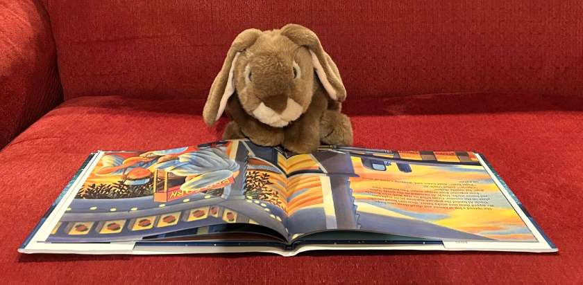 Caramel is reading Night of the Moonjellies by Mark Shasha.