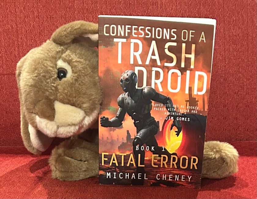 Caramel enjoyed reading Confessions of a Trash Droid: Fatal Error by Michael Cheney and is curious about the future books in the series. 
