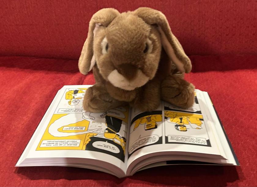 Caramel is reading Tetris: The Games People Play by Brian "Box" Brown.