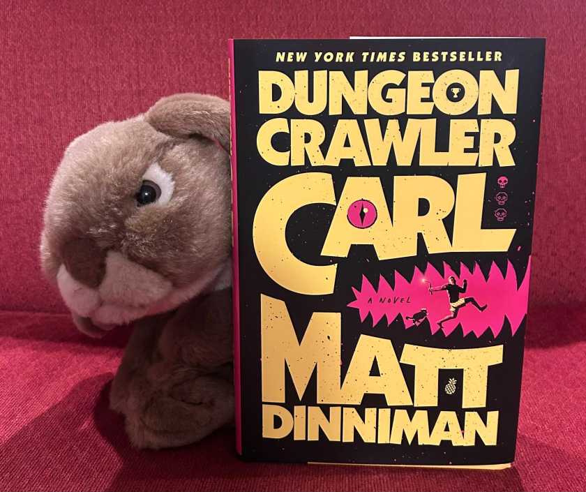 Caramel enjoyed reading Dungeon Crawler Carl by Matt Dinniman and can't wait to get his paws on the second book.