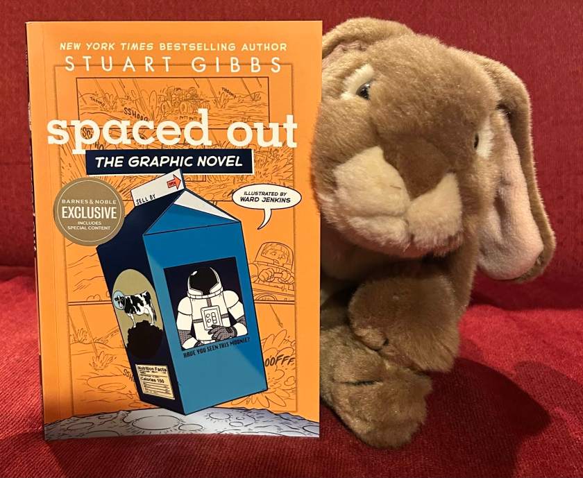Caramel reviews Spaced Out: The Graphic Novel by Stuart Gibbs and Ward Jenkins.