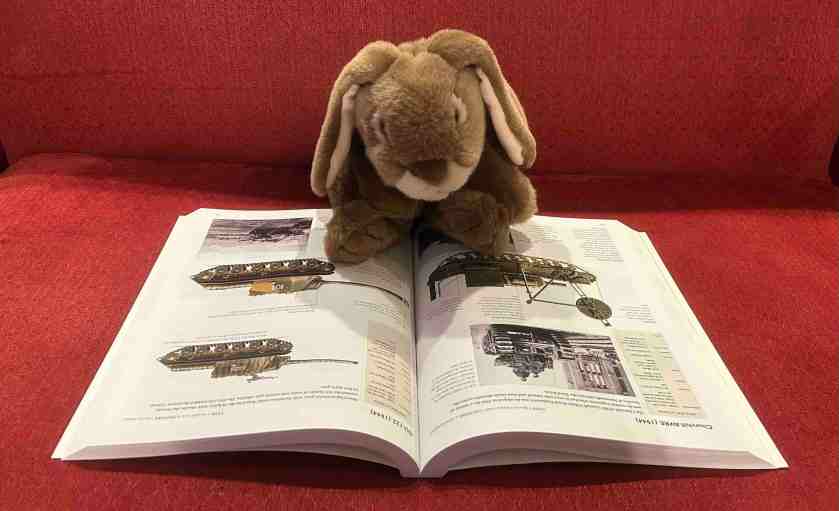 Caramel is reading World War II Encyclopedia of Aircraft, Tanks, and Warships by Chris McNab.